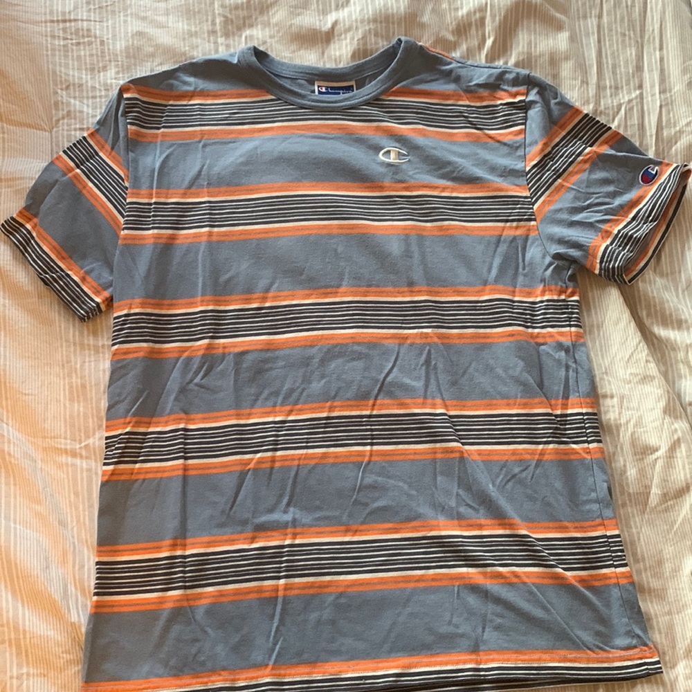Size Medium Champion T Shirt. Light blue with orange, white and navy stripes.